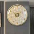 Front view of gold textured round wall clock with raised numerals