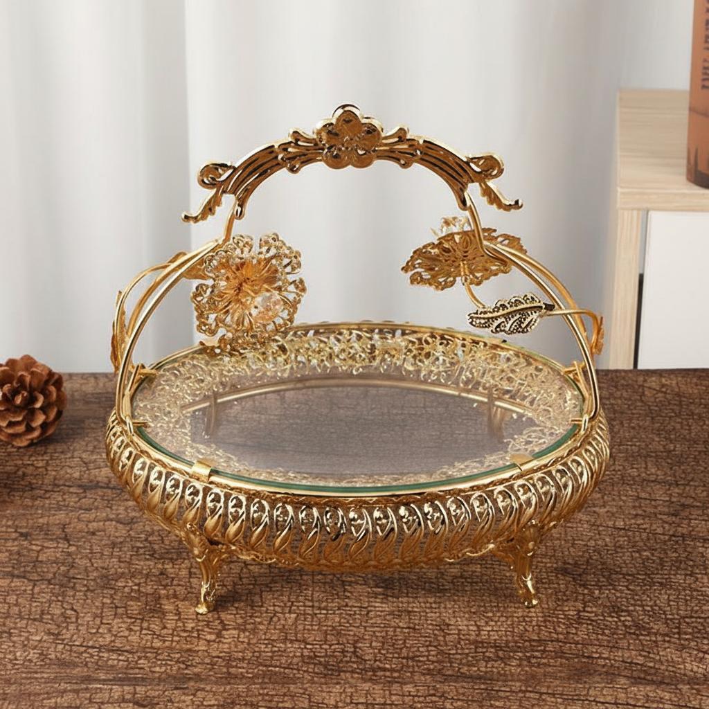 Front view of gold oval serving basket with floral handle