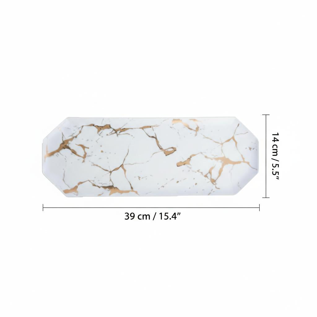 Top down view of white ceramic serving tray with gold marble details