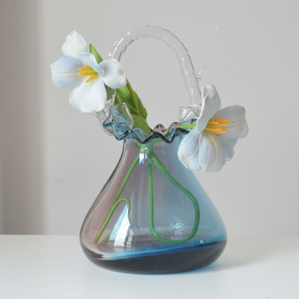 Blue and purple gradient glass basket vase with white flowers