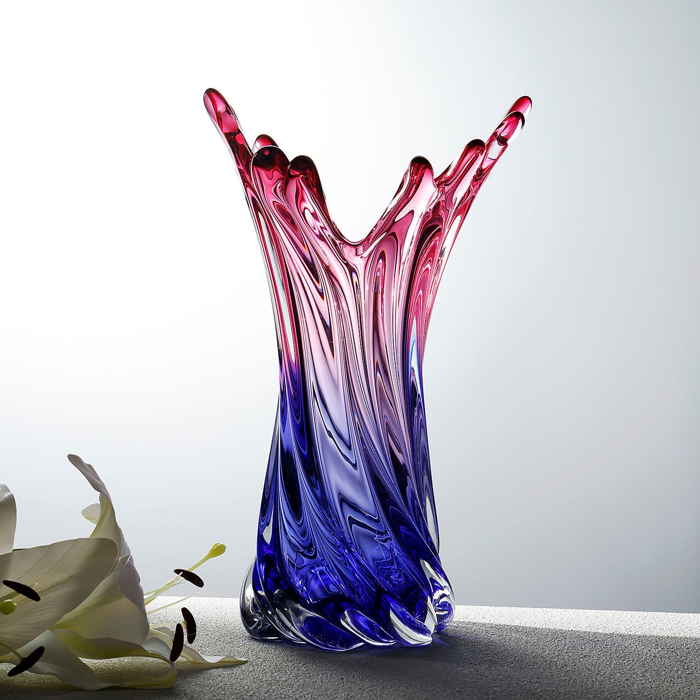 Art glass vase with flowers showing scale