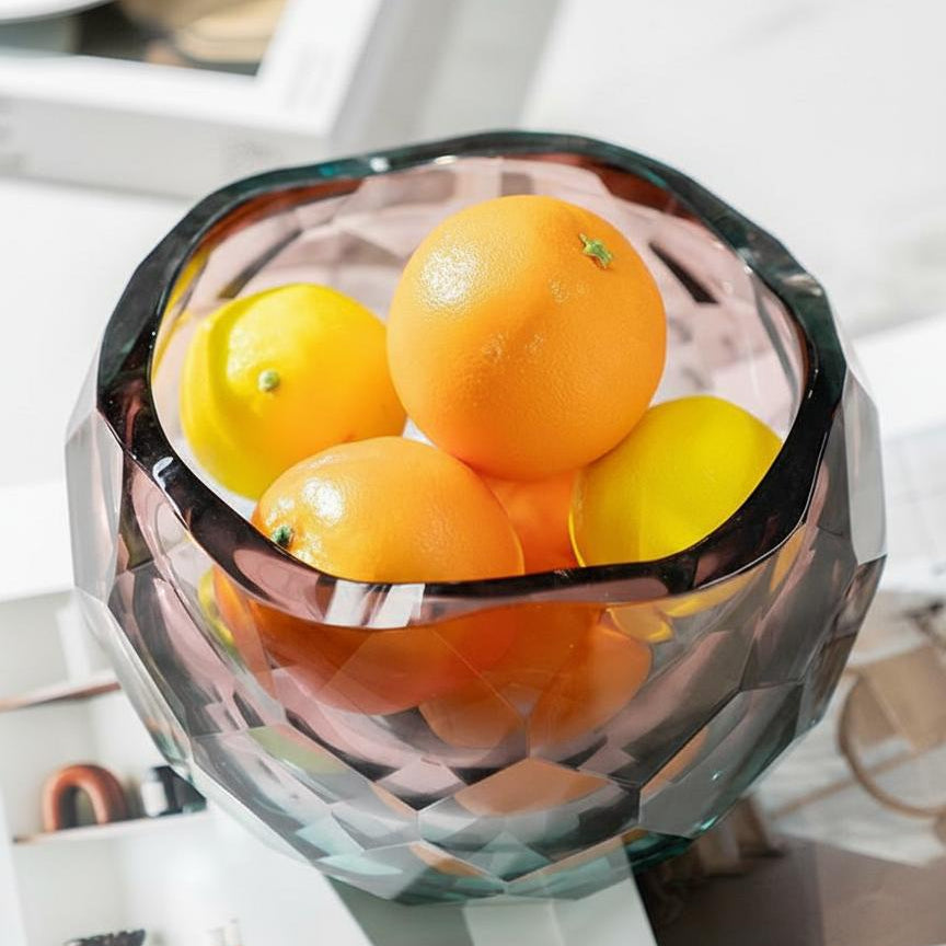 Top down view of gradient glass bowl filled with oranges