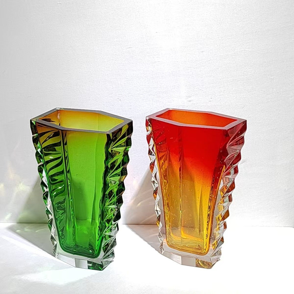 Group shot of red and green gradient glass vases