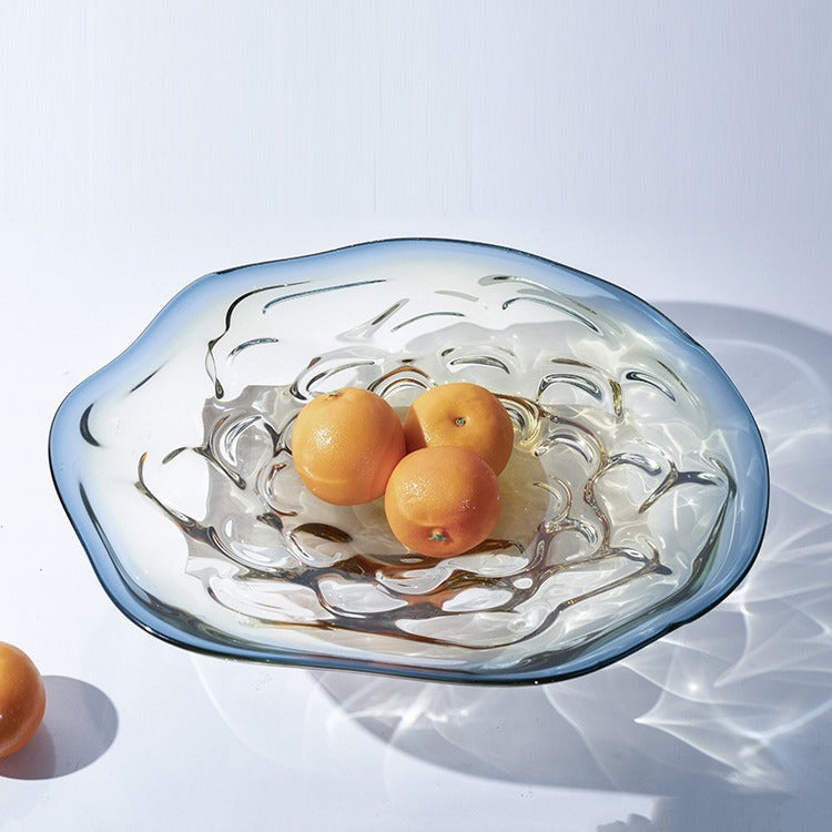 Empty organic glass centerpiece bowl showing blue to amber gradient