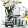 Graphite glass geometric vase styled with pink and white flowers