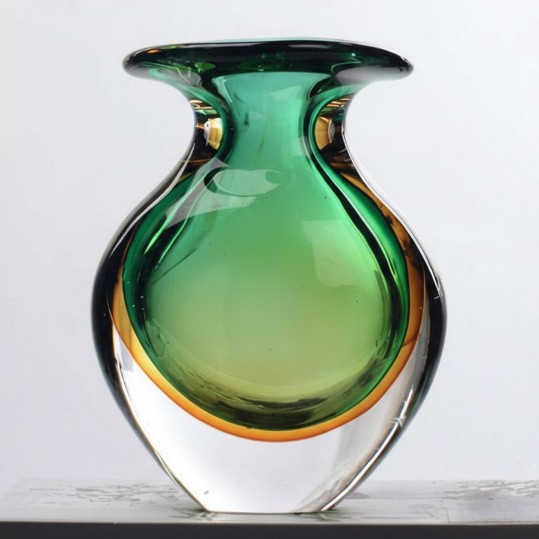 Front view of green and amber art glass vase