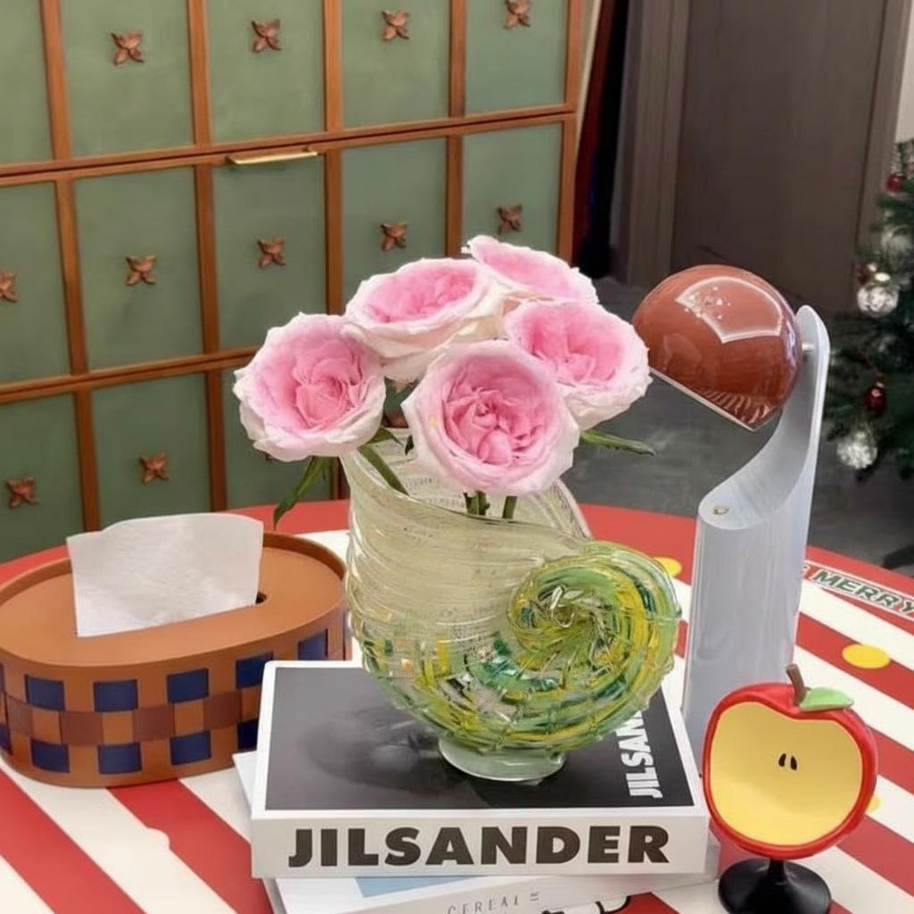 Top view of glass shell vase with roses