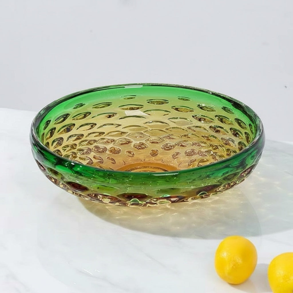 Side view of textured glass centerpiece bowl on white surface