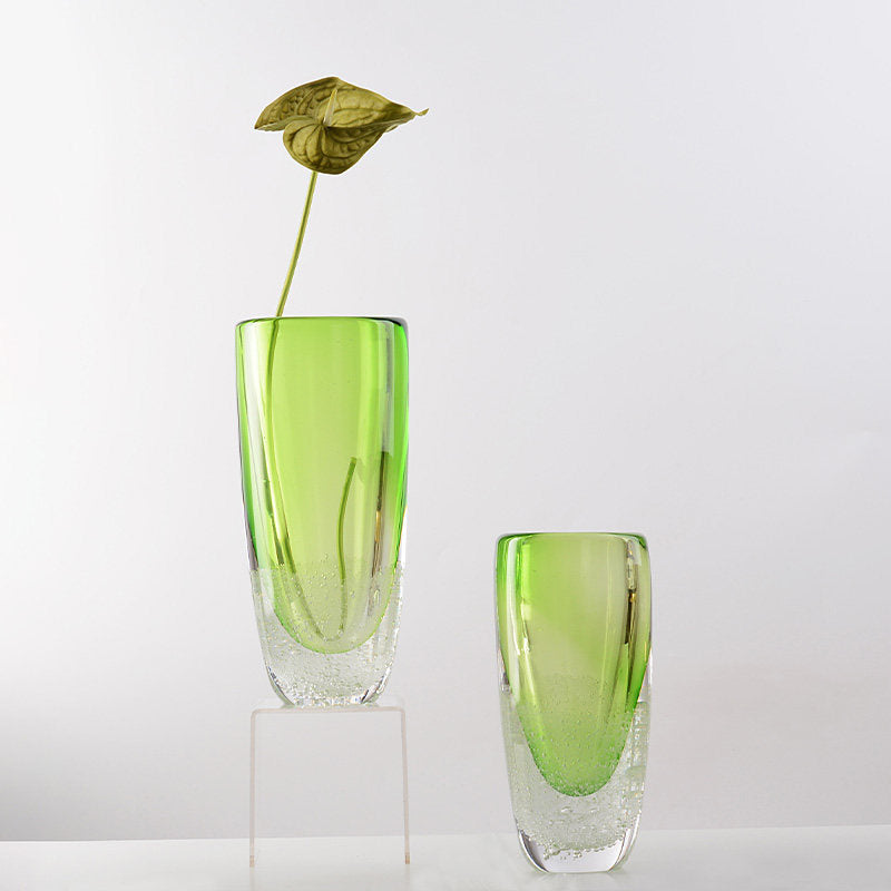 Green bubble glass vase with single flower