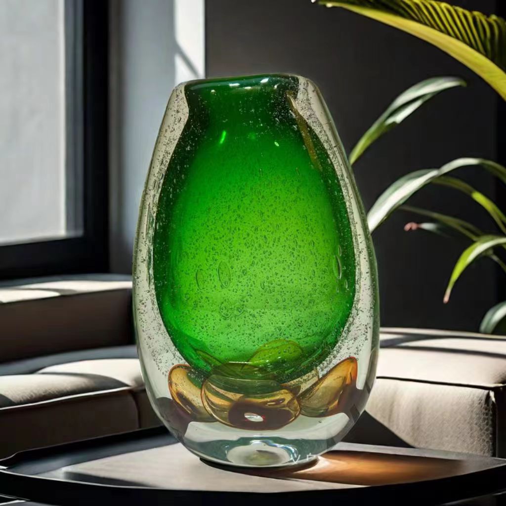 Large green art glass vase with bubble texture on luxury coffee table