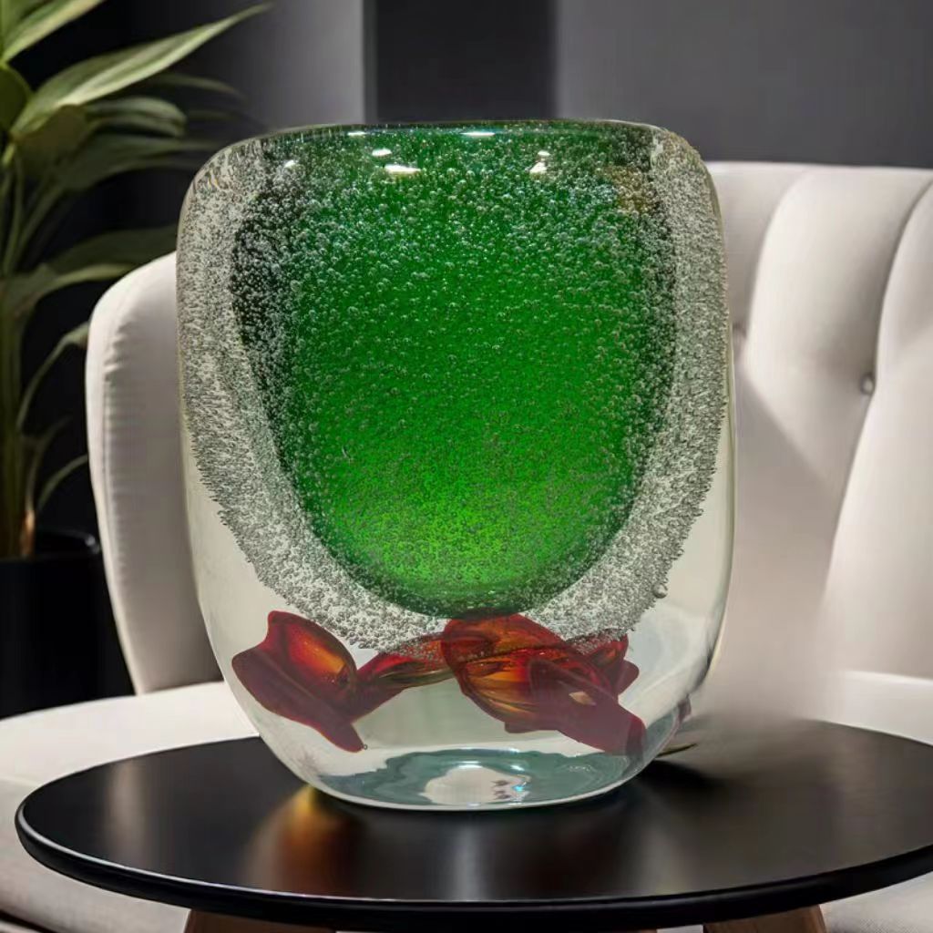 Medium green bubble glass vase displayed on side table