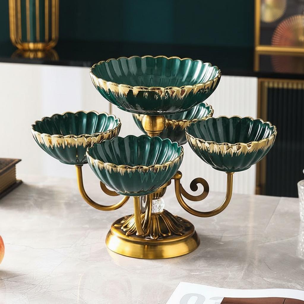 Empty emerald green ceramic and gold metal tiered serving stand showing gold rim details