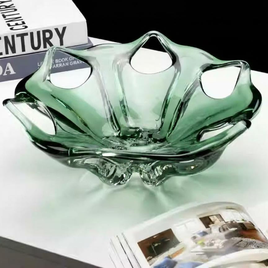 Side view of green art glass bowl showing organic rim