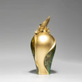 Large green and gold botanical vase side view showing curves