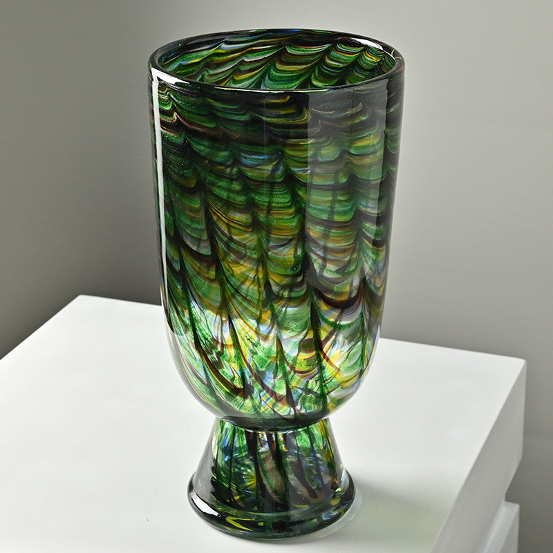 High angle view of green swirled glass vase showing rim thickness