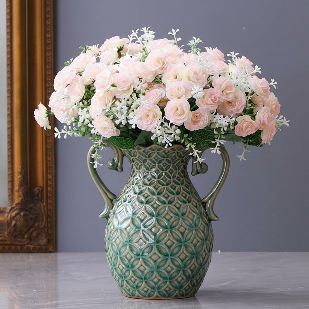 Front view of green ceramic vase with pink flowers