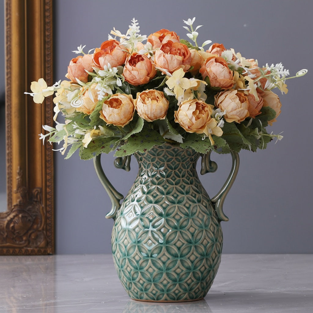 Front view of green ceramic vase with orange flowers