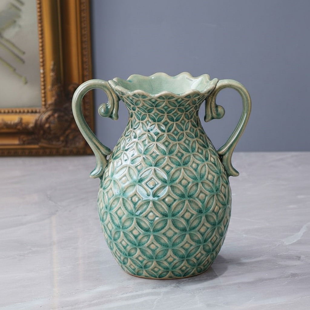 Detailed angled view of empty green ceramic vase showing geometric pattern