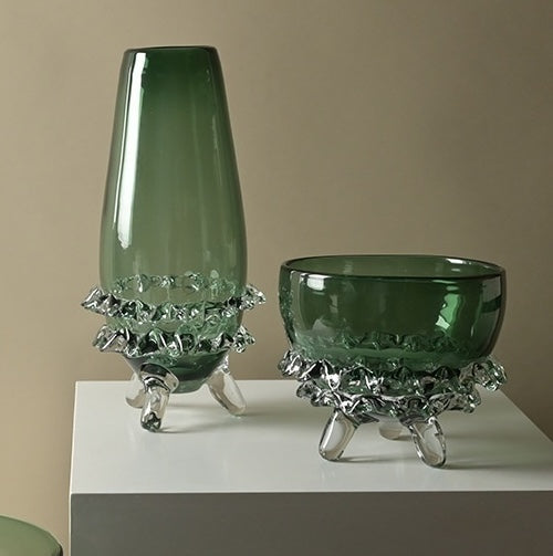 Green glass footed vase and bowl set on white display
