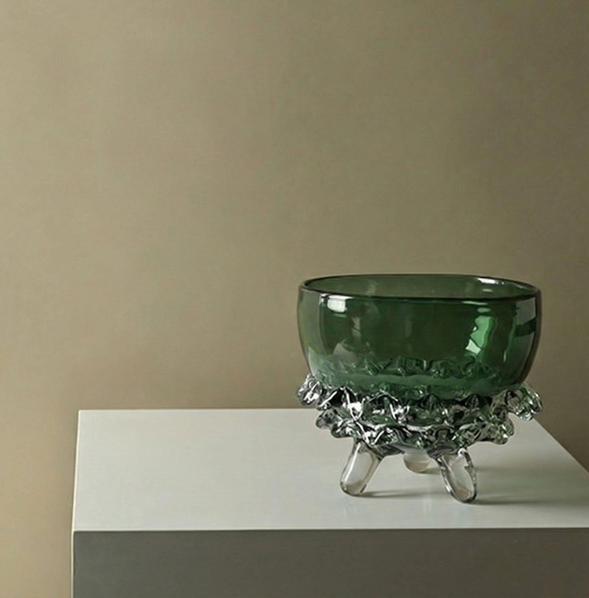 Wide green glass footed bowl with sculptural clear accents