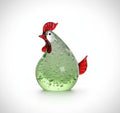 Side view of green and red bubble glass rooster figurine