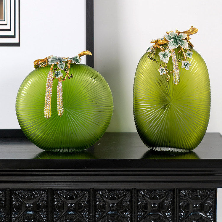 Set of two green glass vases with gold botanical accents