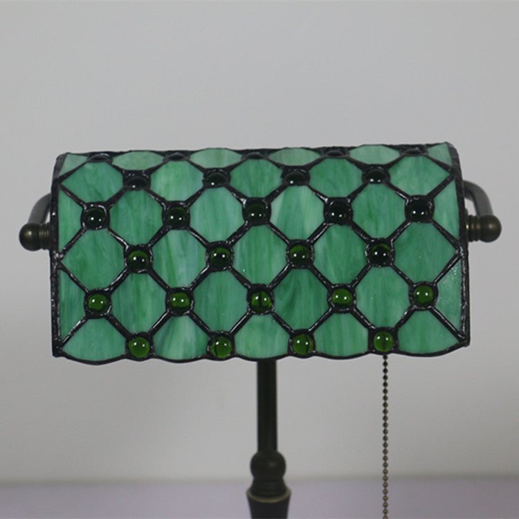 Close up of lattice pattern stained glass shade