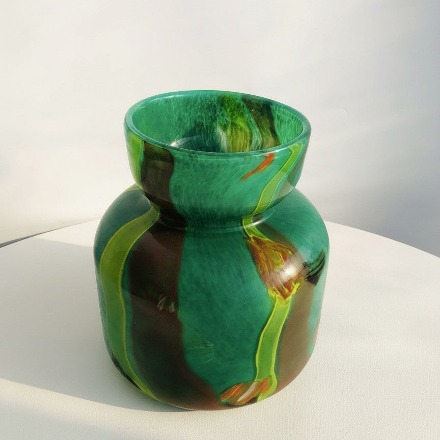 High angle view of green glass vase showing rim