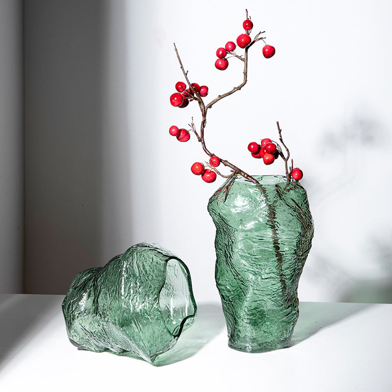 Group shot of tall and medium green textured glass vases with red berries