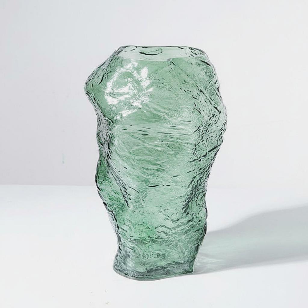 Solo shot of tall green textured glass vase