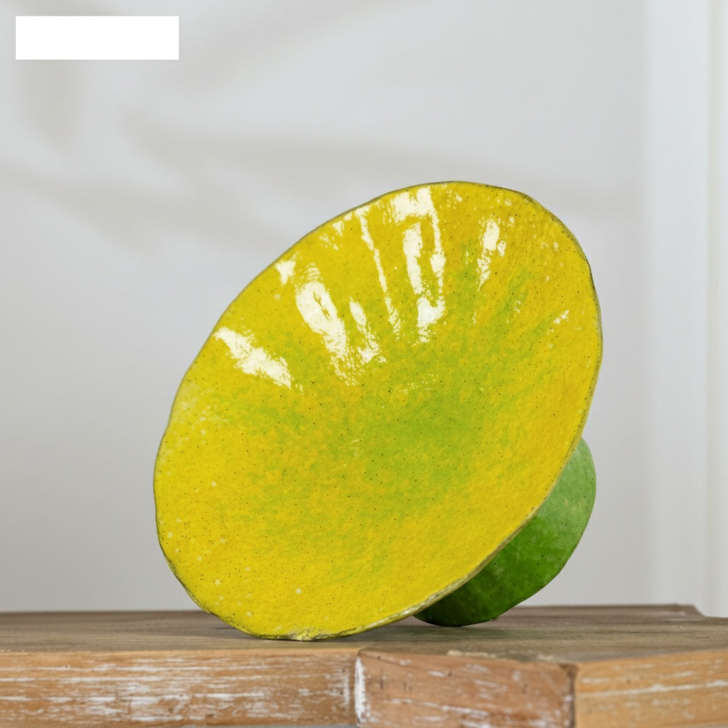 Tilted view showing yellow interior of ceramic dish