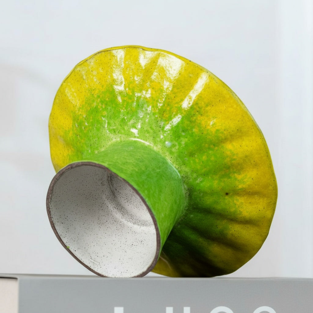 Underside view of ceramic pedestal showing unglazed base