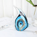 Hand-blown blue glass abstract fish sculpture side view