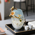 Front view of glass vase with enamel flower detail