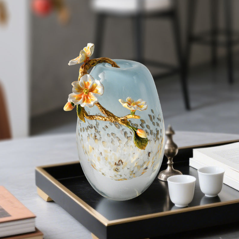 Front view of glass vase with enamel flower detail