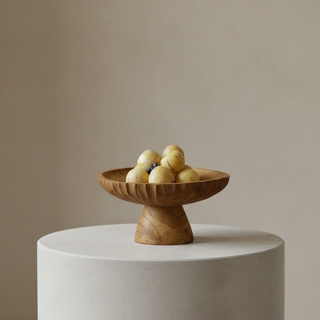 Hand-carved teak fluted pedestal fruit bowl on kitchen island