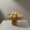 Teak wood fluted fruit centerpiece on living room table