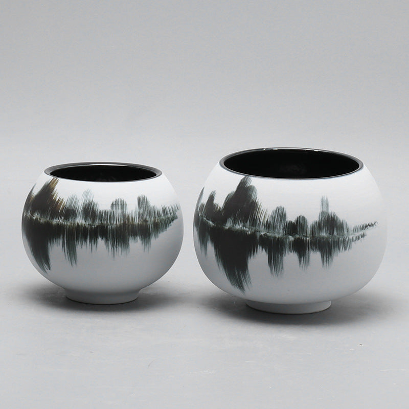 Two hand-painted ceramic orb vases in large and medium sizes