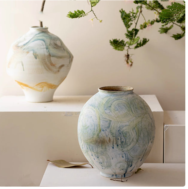 Medium organic shape ceramic vase with blue and gold painting