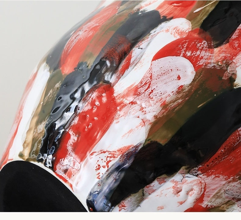 Close up of glossy red black and white ceramic glaze texture