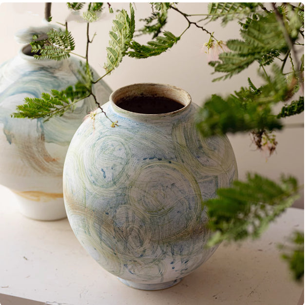 Close up of abstract glazed finish on round vase