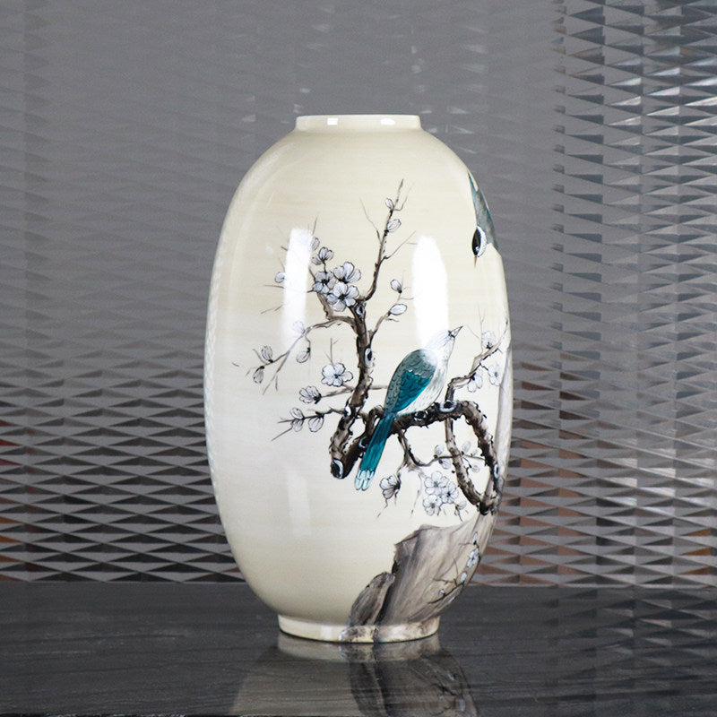 Angled view showing glossy finish and teal bird detail