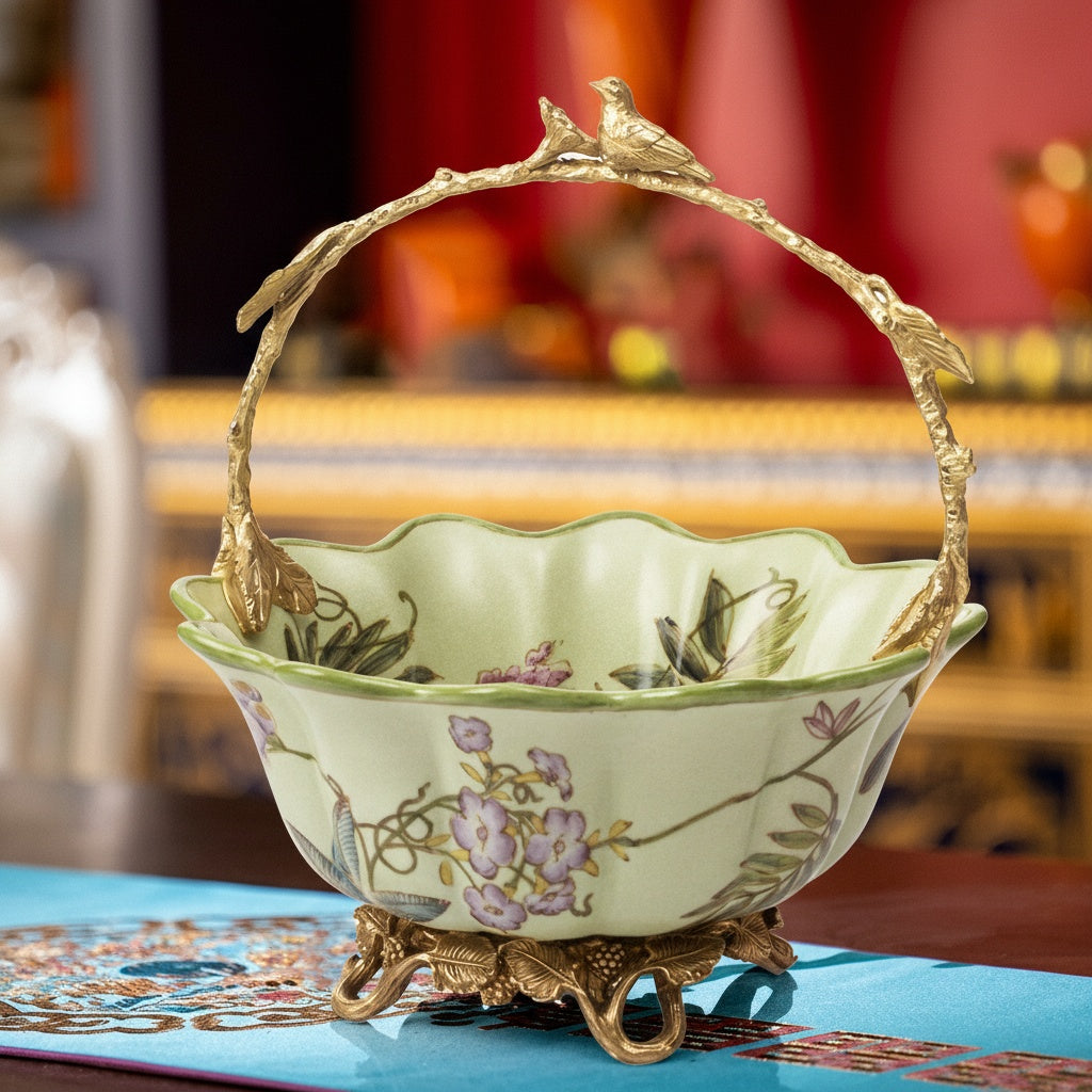 Front view of ceramic basket with brass bird handle on table