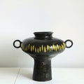 Black ceramic vase with yellow dash pattern