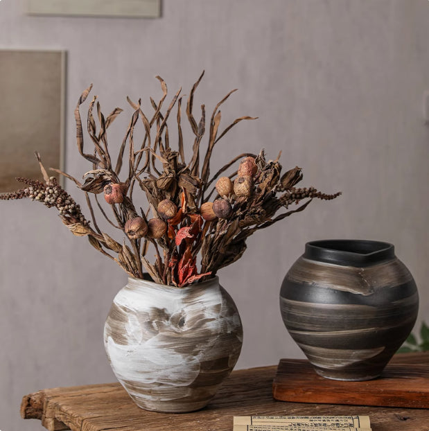 Rustic ceramic vases with dried botanical arrangement lifestyle shot