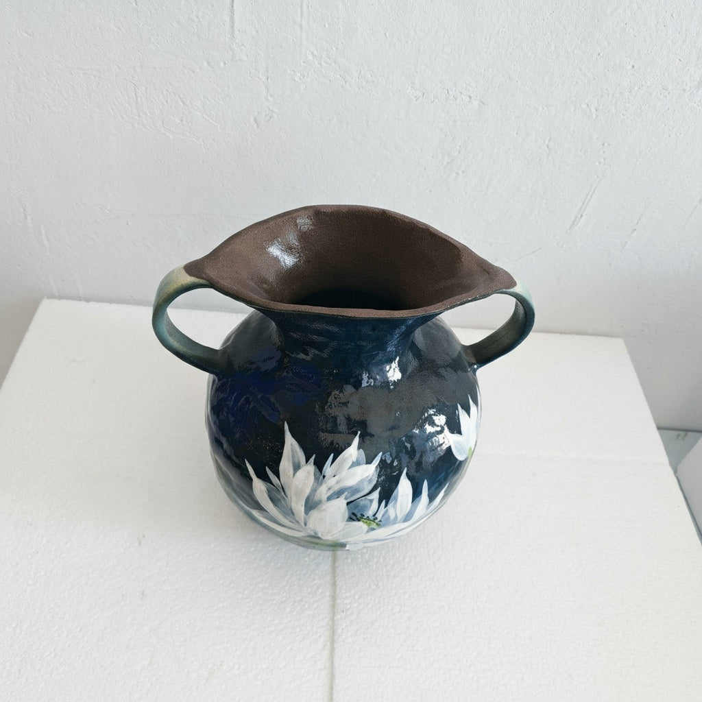 High angle view showing rim and handle details of blue vase