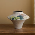 Front view of hand-painted floral ceramic vase with wide tapered shape