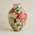 Close up of hand-painted floral ceramic vase