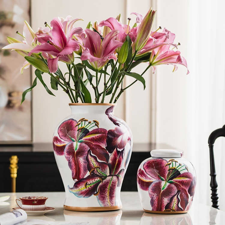 Two floral porcelain vessels with purple lily design