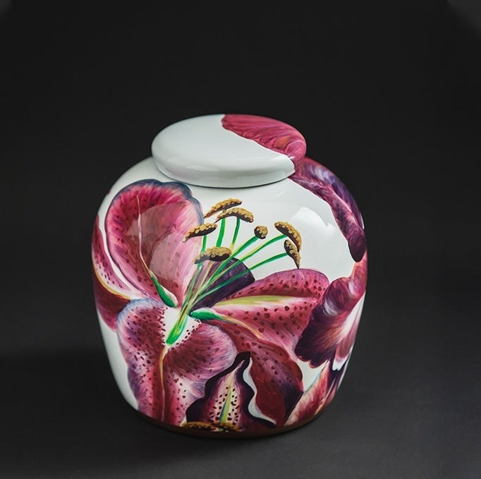 Close up of lidded ginger jar with hand painted lilies